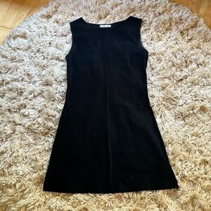 Newport woman’s simple classic sleeveless black dress fits likes a M